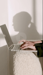 woman typing on laptop